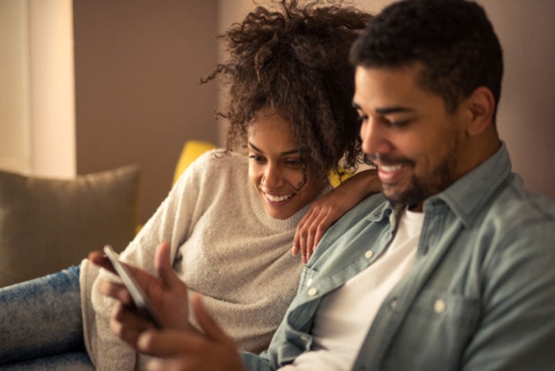 Black Couple with Tablet