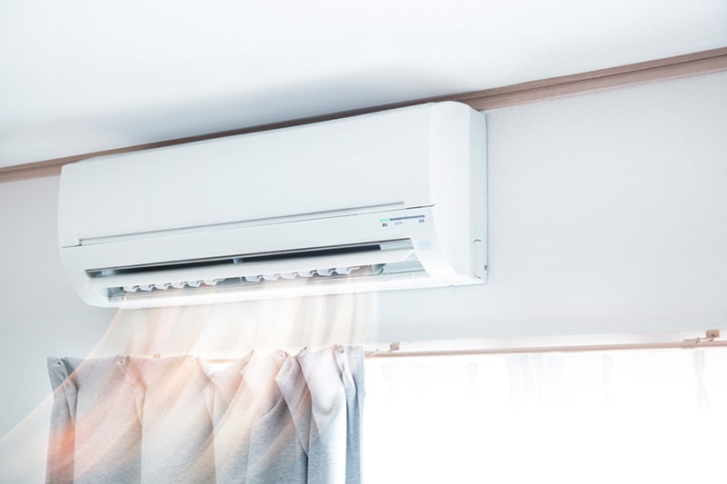 Ductless system pictured above a window