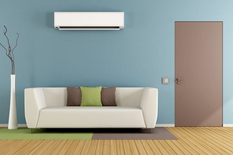 Image of ductless system above couch. Planning to Remodel? Go Ductless!.